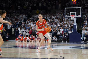 Syracuse embarked on two separate 8-0 runs in the second half, but UConn held off each, leading it to the Sweet 16. 